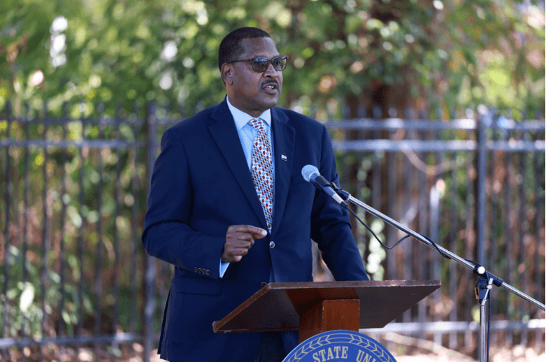 Dr. Homer Wilkes speaking